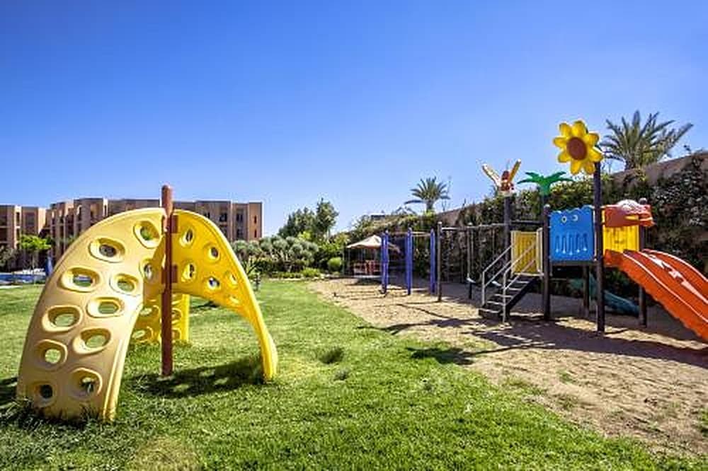 Climbing frame and slides on the lawn