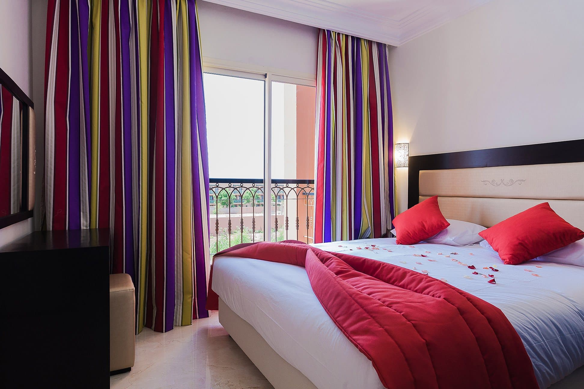 Senior Suite main bedroom with colourful curtains