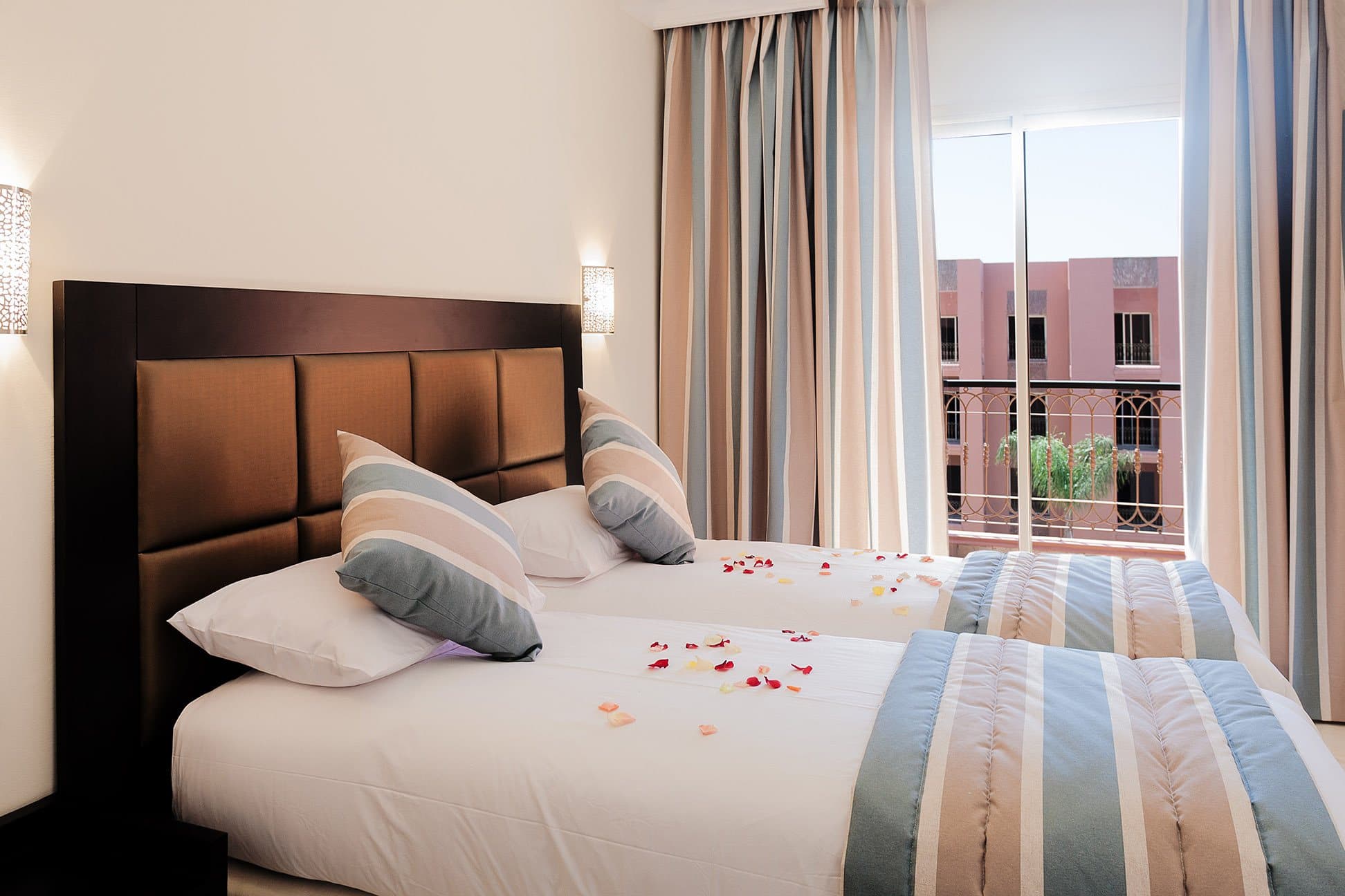 Twin beds with striped throws